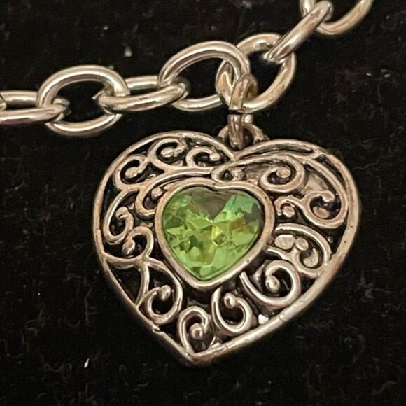 7” silver tone rolo chain bracelet w/0.75” filigree heart w/peridot center - Picture 2 of 9